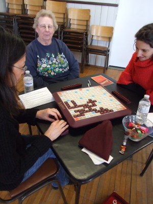 Alice (centre) seems pleased with her scrabble letters while Lily (left), Committee Treasurer ponders her move and Sarah(right) exudes winning confidence.