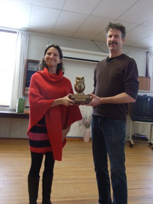 The Winner is Sarah Keelan-Bishop accepting the "Hoot" award from award maker Glen Wallis.